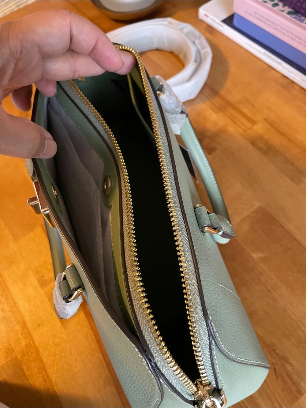 The Kate Spade KK114 refers specifically to the Phoebe East West Satchel